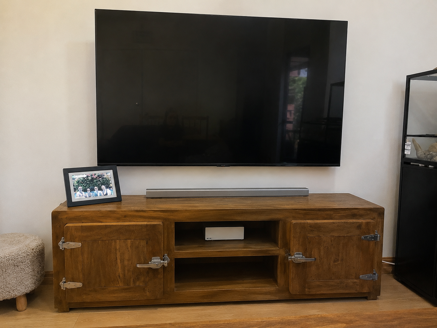 TV wall mount installation with concealed cabling and soundbar